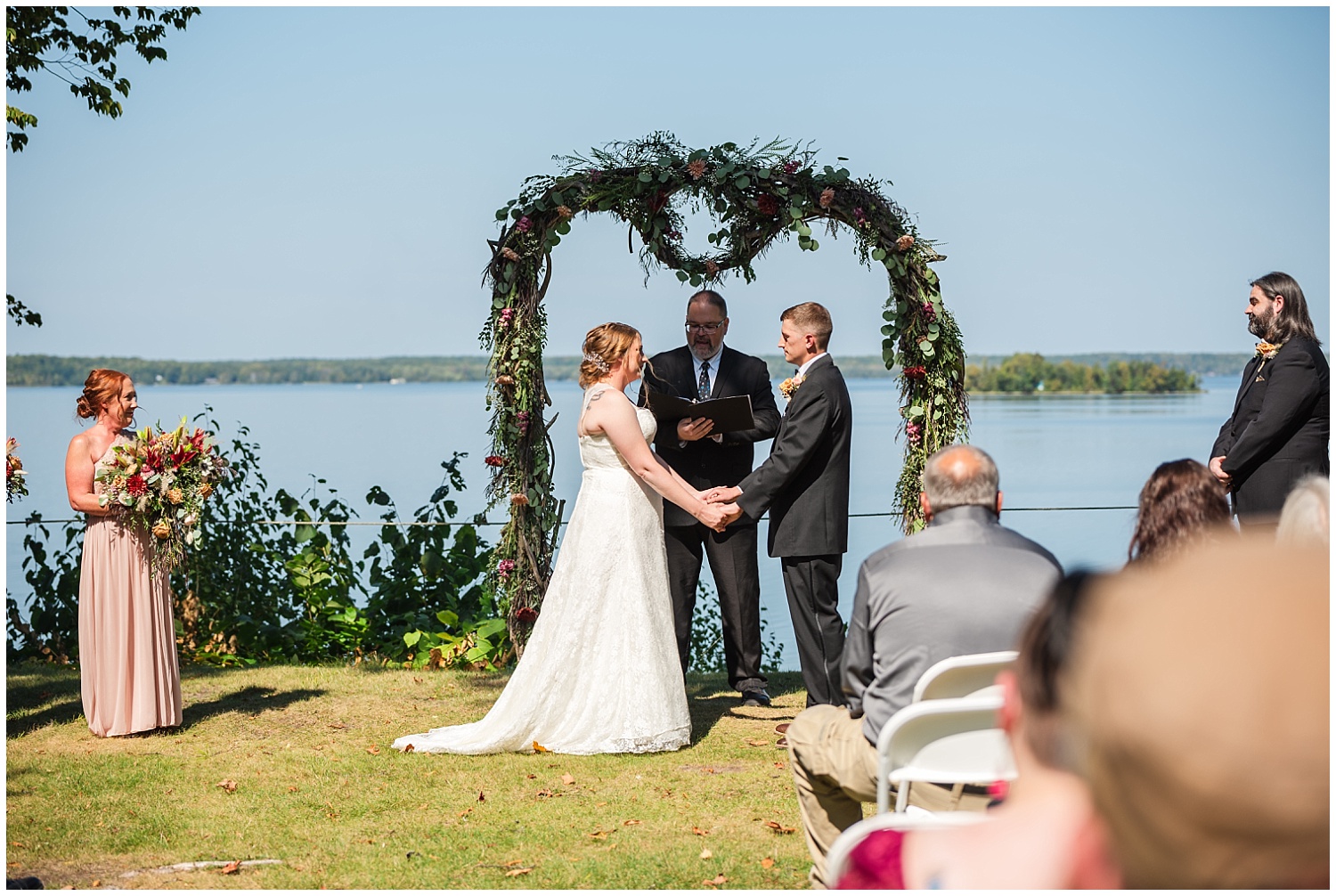 early fall wedding at chamberlin ole forest inn overlooking manistique lake