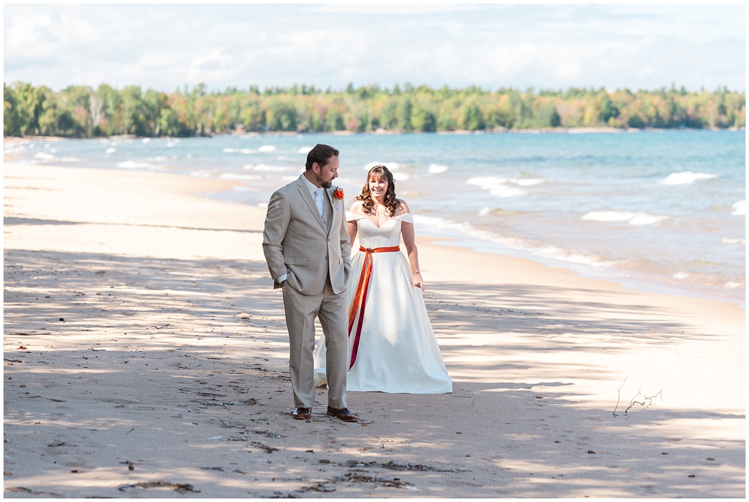 bride and groom first look on lake superior beach